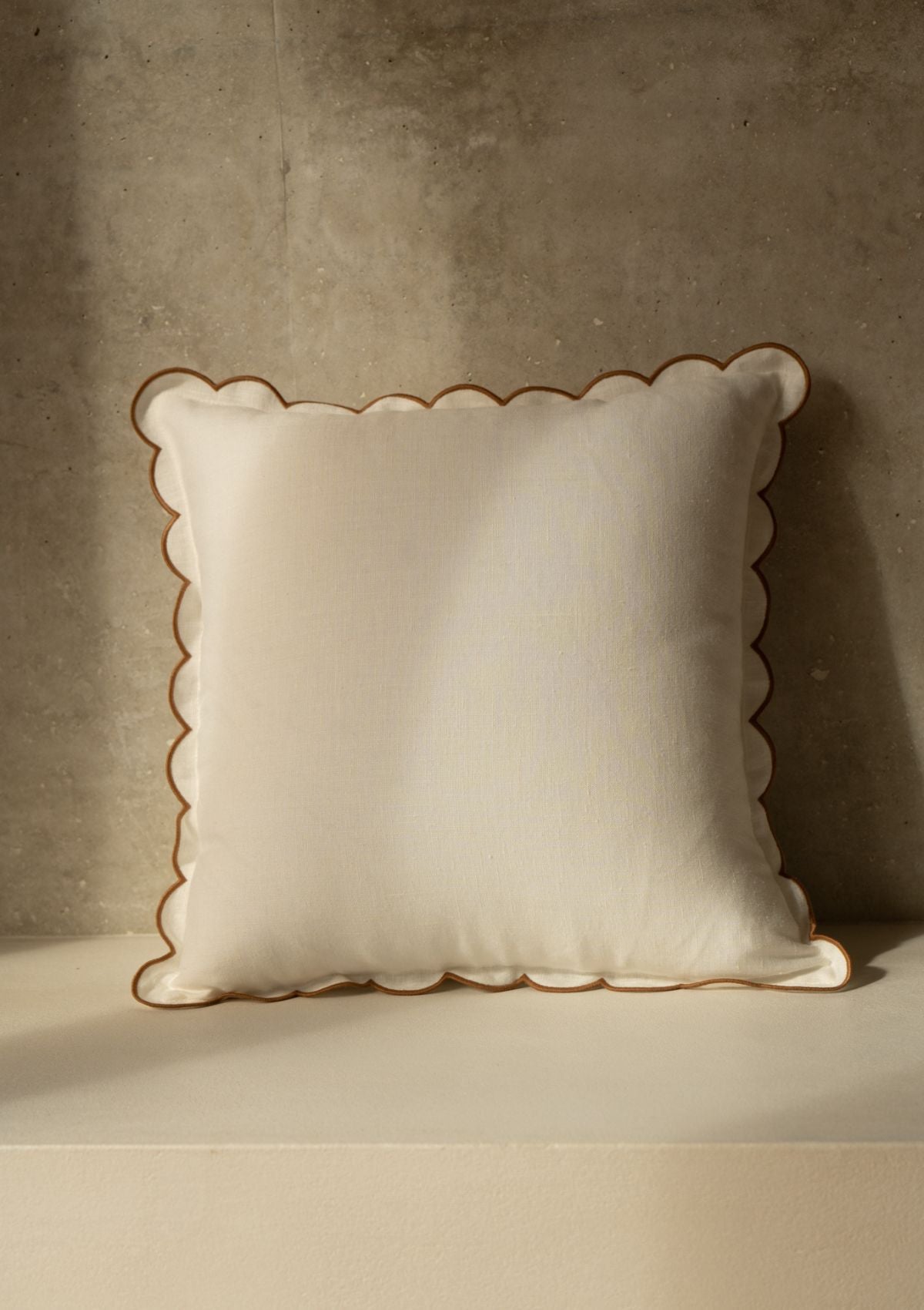The square scalloped linen cushion in White & Yellow ocher