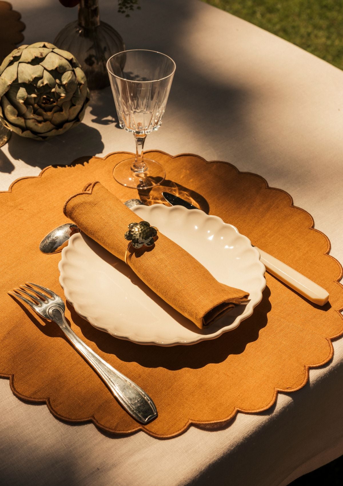 Yellow ocher scalloped round linen placemats (set of 2)