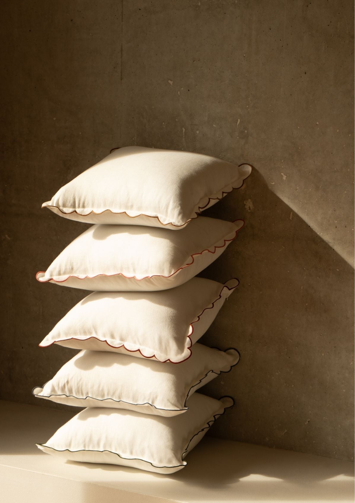 The square scalloped linen cushion in White & Yellow ocher