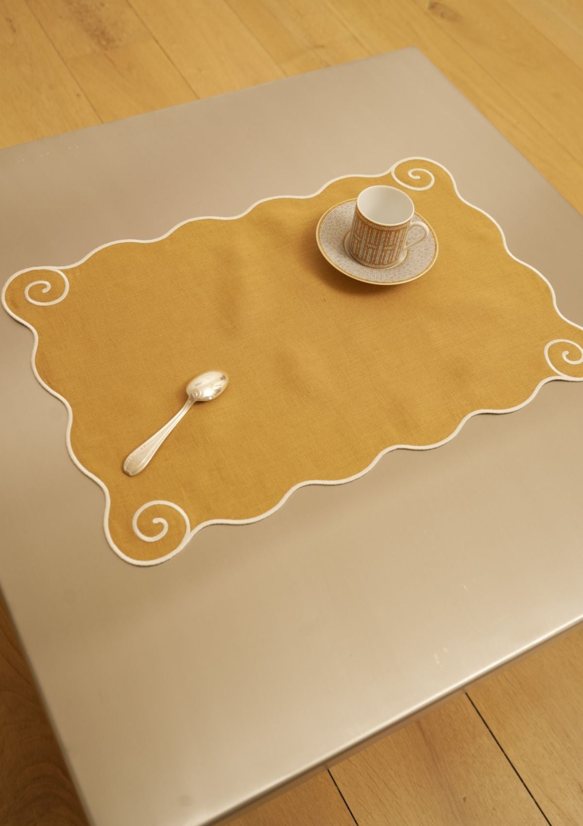 The Volute Placemat in Ochre Yellow & White Linen