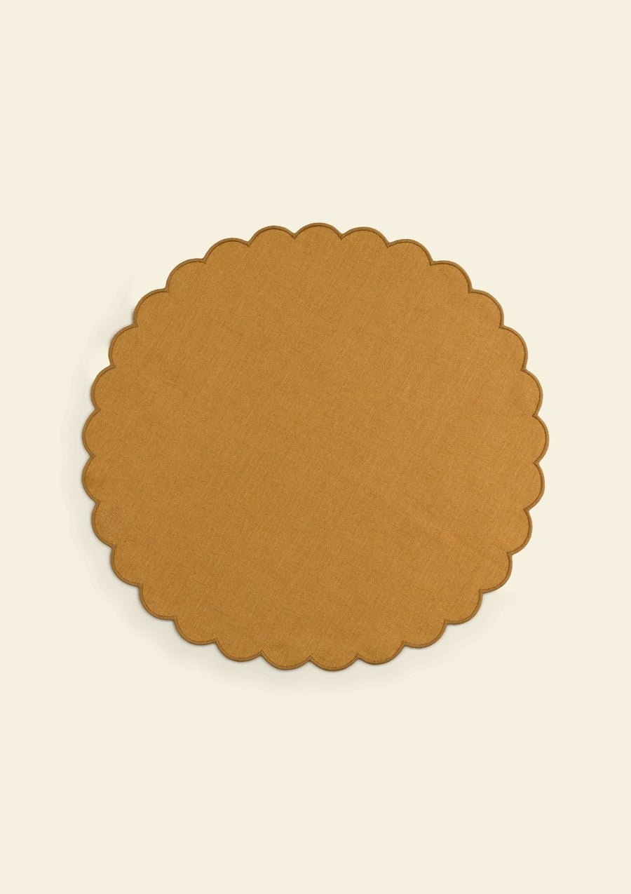 Yellow ocher scalloped round linen placemat