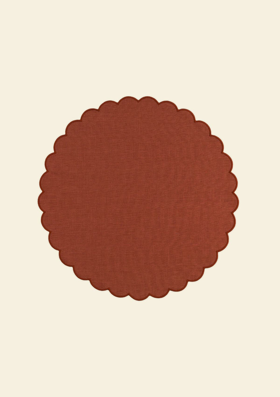 Red ocher scalloped round linen placemat