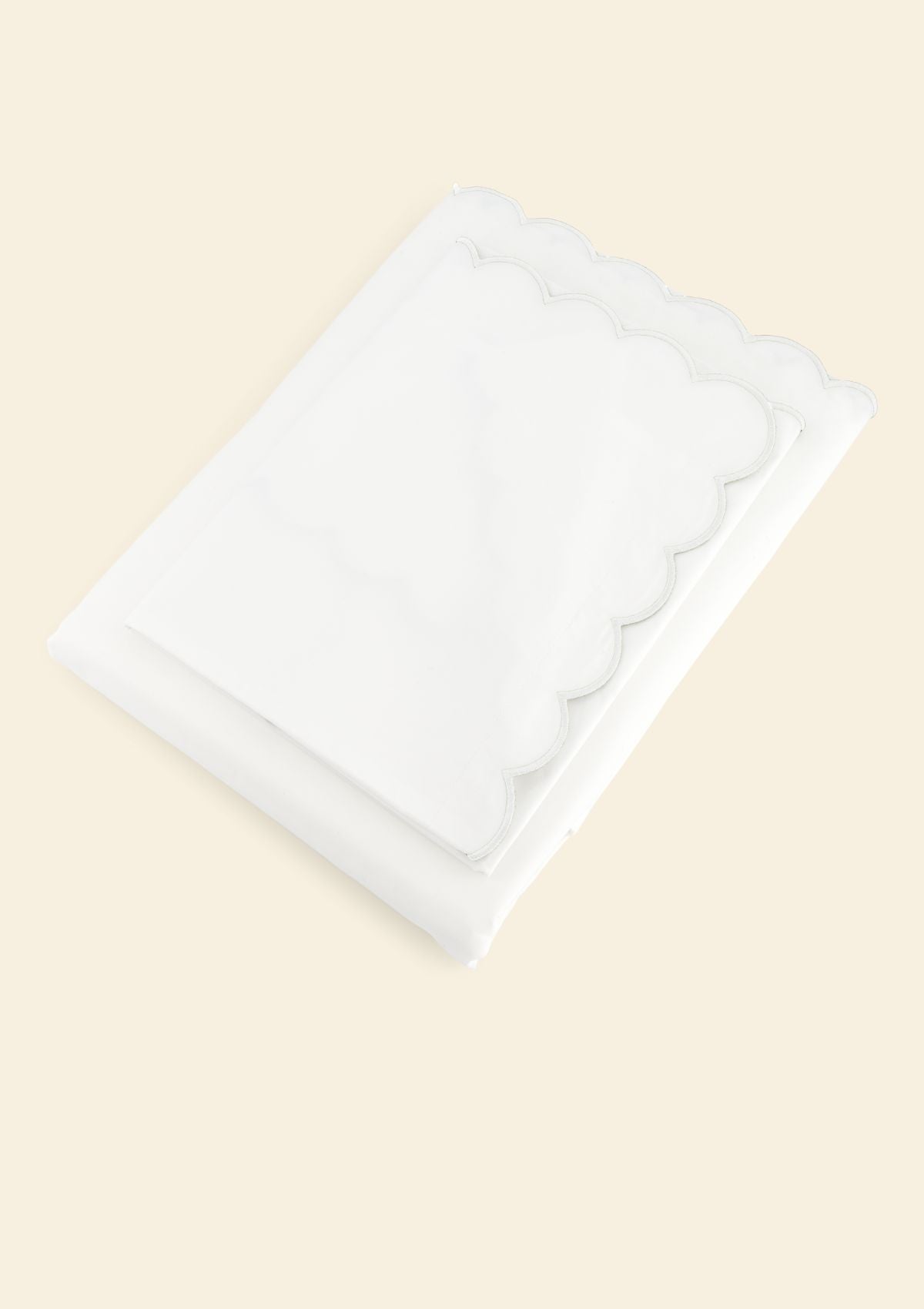 The scalloped bed set in white cotton percale