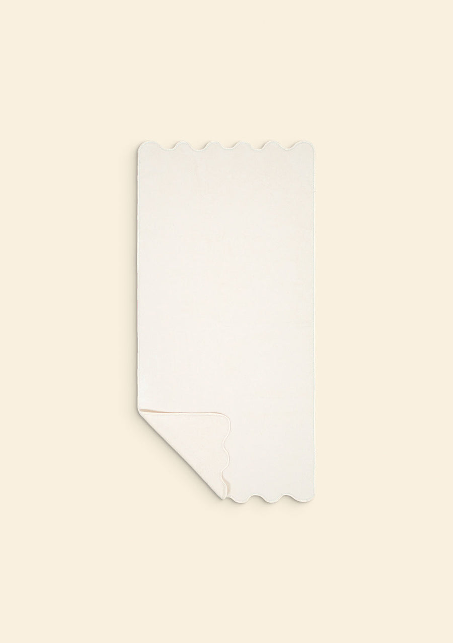 La serviette de bain ondulée en coton ivoire