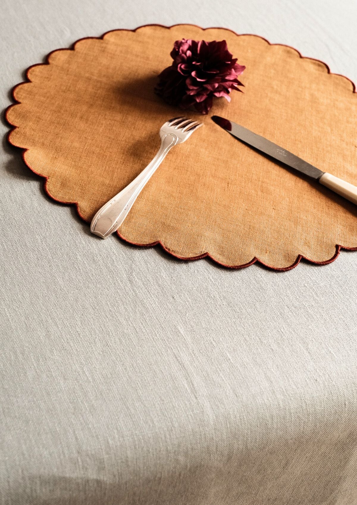 Yellow ocher & red ocher scalloped round linen placemats (set of 2)