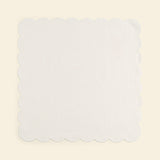 Scalloped white linen napkins