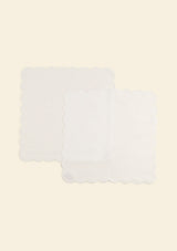 Scalloped white linen napkins